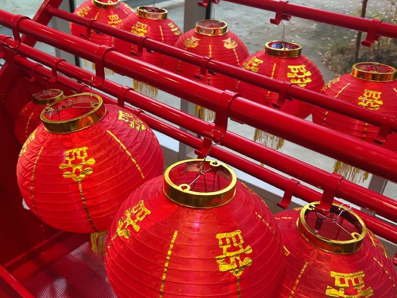 close up photo of red Chinese lanterns with golden characters