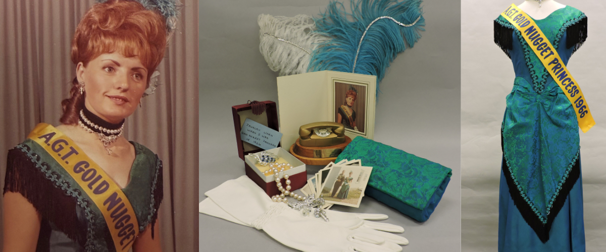 A display of personal items. White gloves, a strand of pearls, rhinestone jewellery, an open jewellery box containing a brooch and note reading "Jewelry worn when I was Gold Nugget Princess in 1966," a miniature gold telephone trophy on a wooden base, a portrait of Simone Bessette in a folded frame, several vintage snapshots, a folded turquoise patterned hand purse, and large white and turquoise feathers draped behind the display.