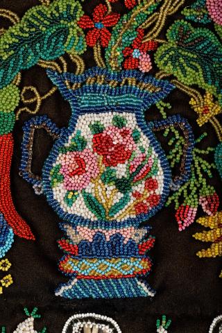 A close-up image of a beaded vase from a Métis octopus bag