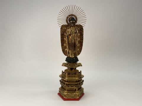 A photo of a golden Buddha statue.