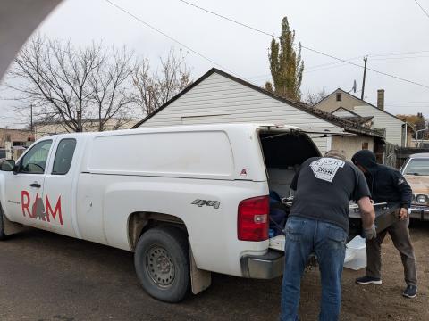 Flashback sign being loaded into truck