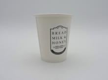 A cup from Bread, Milk, & Honey, where Harper-Hugo and Will had their first date