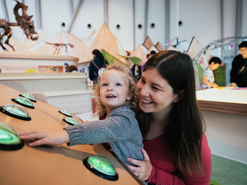 A mother and her child play in the Children's Gallery.